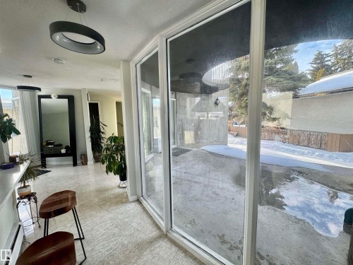 Doorway to outside with a baseboard radiator - 9535 147 Avenue, Edmonton, AB -  With Exterior