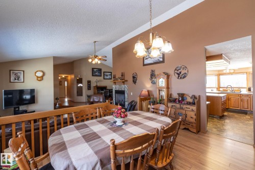 Just a step or two up from the living room, the dining room is also a great spot to enjoy morning sunrise views while enjoying morning coffee or meals with family and friends. - 57524 Range Road 270, Rural Westlock County, AB - Indoor Photo Showing Dining Room