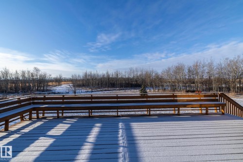 Wow!  West facing deck, equipped with benches. Stairs give access to a concrete patio.  Enjoy the sun while it's out and savour the sunsets. - 57524 Range Road 270, Rural Westlock County, AB - Outdoor With View