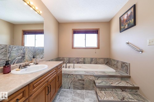 "Step into it"  and then relax.  Spa like oasis/retreat. Huge vanity with plenty of space for storing necessities and enough mirror "face space" for hair, makeup, etc. - 57524 Range Road 270, Rural Westlock County, AB - Indoor Photo Showing Bathroom