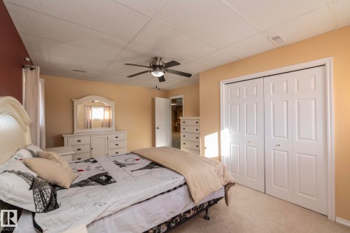 Looking toward the door, double doored closet give plenty of storage space. Any age would be more than comfortable in this bedroom! - 57524 Range Road 270, Rural Westlock County, AB - Indoor Photo Showing Bedroom