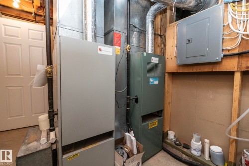 In here are the 2 furnaces--1 for each level of the home. Electrical panel(s), sump pump, etc. [ the garage has its own furnace too--located in the garage]. - 57524 Range Road 270, Rural Westlock County, AB - Indoor Photo Showing Basement