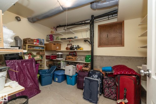 Conveniently located at the foot of the stairs, this room has plenty of storage space. There's an access panel to the garage for easy pass-through. This storage is an additional spot in addition to the available space under the stairs. - 57524 Range Road 270, Rural Westlock County, AB - Indoor