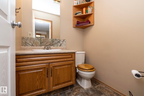 This 2 piece Powder Room is right beside the laundry room. Also right by back entry stairs and the garage. - 57524 Range Road 270, Rural Westlock County, AB - Indoor Photo Showing Bathroom