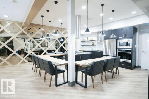 Dining area with light wood-type flooring and recessed lighting - 101 7471 May Common, Edmonton, AB - Indoor