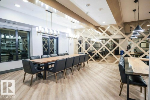 Dining room featuring light wood-style floors, recessed lighting, and a chandelier - 101 7471 May Common, Edmonton, AB - Indoor Photo Showing Dining Room