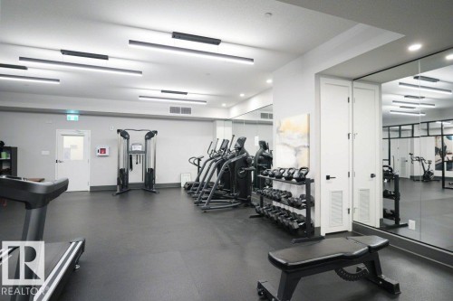 View of workout area - 101 7471 May Common, Edmonton, AB - Indoor Photo Showing Gym Room