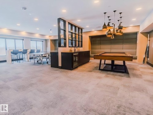Playroom featuring bar with sink and pool table - 101 7471 May Common, Edmonton, AB - Indoor Photo Showing Other Room