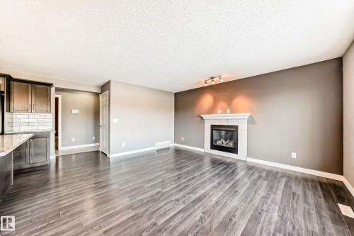 3520 49 Avenue, Beaumont, AB - Indoor Photo Showing Living Room With Fireplace