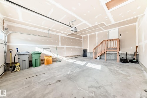 Garage featuring a garage door opener - 3520 49 Avenue, Beaumont, AB - Indoor Photo Showing Garage
