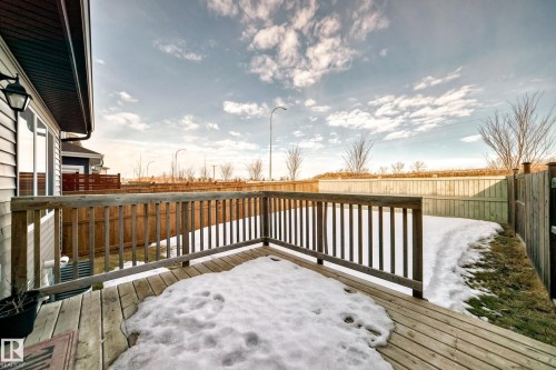 Snow covered deck featuring a fenced backyard - 3520 49 Avenue, Beaumont, AB - Outdoor With Deck Patio Veranda With Exterior