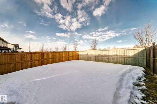 Snowy yard featuring a fenced backyard - 3520 49 Avenue, Beaumont, AB - Outdoor