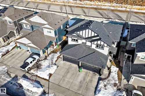 Snowy aerial view with a residential view - 3520 49 Avenue, Beaumont, AB - Outdoor