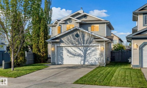 View of front of home featuring a garage and concrete driveway - 4604 202 Street, Edmonton, AB - Outdoor