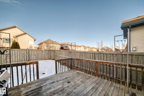 Wooden terrace featuring a residential view, a fenced backyard, and a grill - 4604 202 Street, Edmonton, AB - Outdoor With Deck Patio Veranda With Exterior