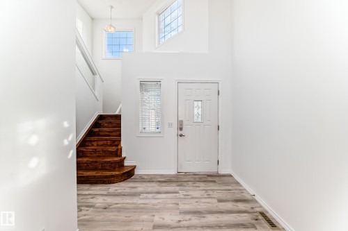 Foyer featuring light wood finished floors and a high ceiling - 4604 202 Street, Edmonton, AB - Indoor Photo Showing Other Room