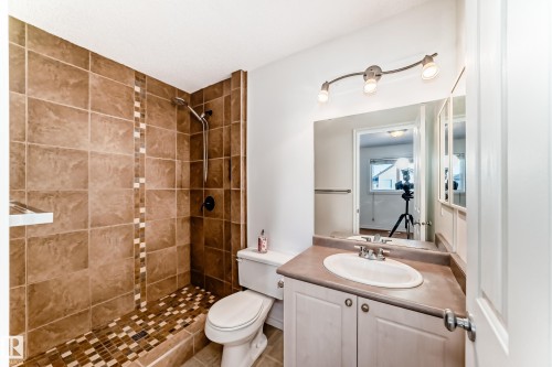 Bathroom with tiled shower and vanity - 4604 202 Street, Edmonton, AB - Indoor Photo Showing Bathroom