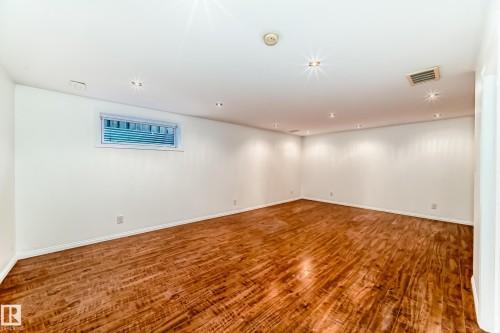 Below grade area featuring wood finished floors and recessed lighting - 4604 202 Street, Edmonton, AB - Indoor Photo Showing Other Room