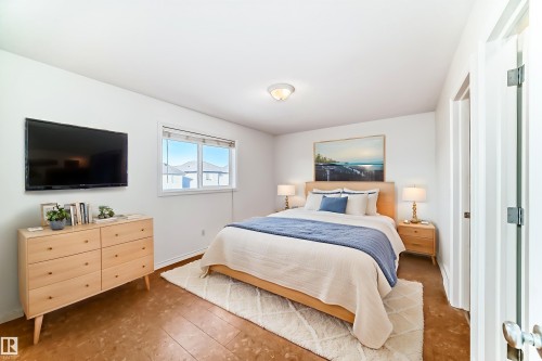 Bedroom featuring baseboards and hardwood / wood-style floors - 4604 202 Street, Edmonton, AB - Indoor Photo Showing Bedroom