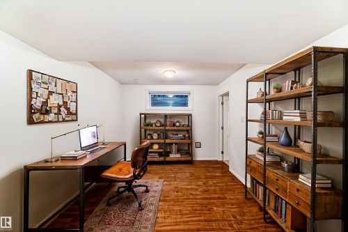 Office space with wood finished floors and baseboards - 4604 202 Street, Edmonton, AB - Indoor Photo Showing Office