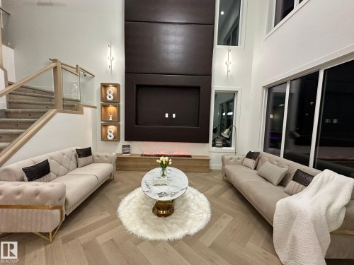 Living room featuring a high ceiling and parquet flooring - 132 29 Street, Edmonton, AB - Indoor Photo Showing Living Room