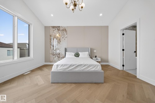 Bedroom featuring parquet flooring, a chandelier, and recessed lighting - 132 29 Street, Edmonton, AB - Indoor Photo Showing Bedroom