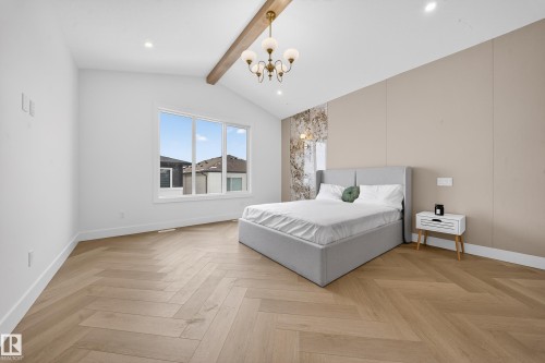 Bedroom with parquet floors, a chandelier, and recessed lighting - 132 29 Street, Edmonton, AB - Indoor Photo Showing Bedroom