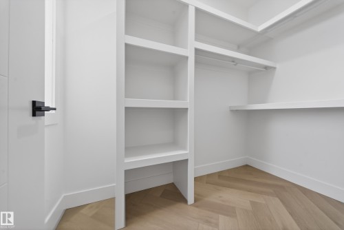 Spacious closet featuring parquet flooring - 132 29 Street, Edmonton, AB - Indoor With Storage