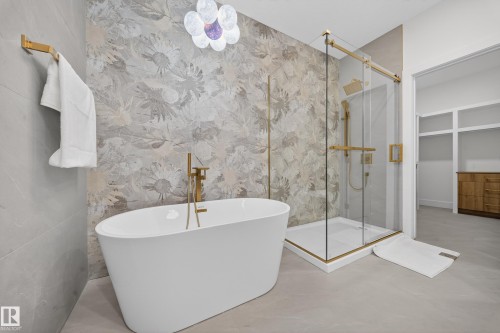 Full bath featuring a marble finish shower and a freestanding bath - 132 29 Street, Edmonton, AB - Indoor Photo Showing Bathroom