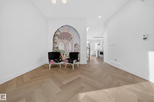 Sitting room with parquet flooring, recessed lighting, and stairs - 132 29 Street, Edmonton, AB - Indoor Photo Showing Other Room