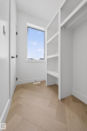 Spacious closet with parquet flooring - 132 29 Street, Edmonton, AB - Indoor Photo Showing Other Room