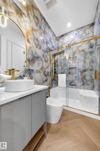 Bathroom with vanity, a marble finish shower, and parquet floors - 132 29 Street, Edmonton, AB - Indoor Photo Showing Bathroom