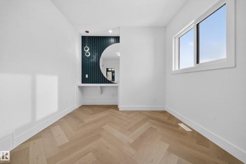 Spare room featuring parquet flooring and recessed lighting - 132 29 Street, Edmonton, AB - Indoor Photo Showing Other Room