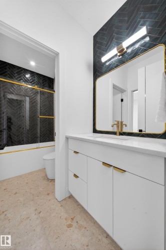 Bathroom featuring bath / shower combo with glass door and vanity - 132 29 Street, Edmonton, AB - Indoor Photo Showing Bathroom