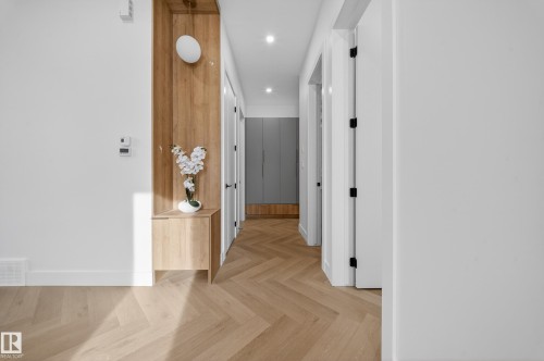 Hall with parquet floors and recessed lighting - 132 29 Street, Edmonton, AB - Indoor Photo Showing Other Room