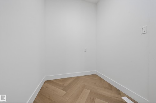 Empty room featuring parquet floors and baseboards - 132 29 Street, Edmonton, AB - Indoor Photo Showing Other Room