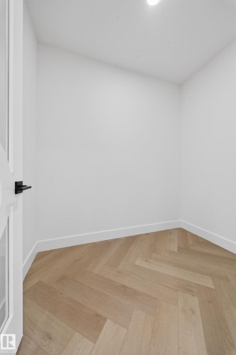 Empty room with parquet floors and baseboards - 132 29 Street, Edmonton, AB - Indoor Photo Showing Other Room