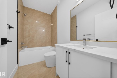 Full bath featuring vanity and tub / shower combination - 132 29 Street, Edmonton, AB - Indoor Photo Showing Bathroom