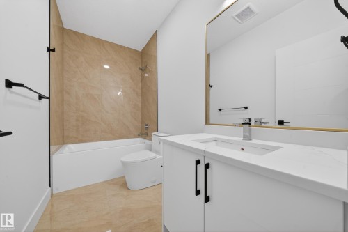 Full bathroom featuring vanity and  shower combination - 132 29 Street, Edmonton, AB - Indoor Photo Showing Bathroom
