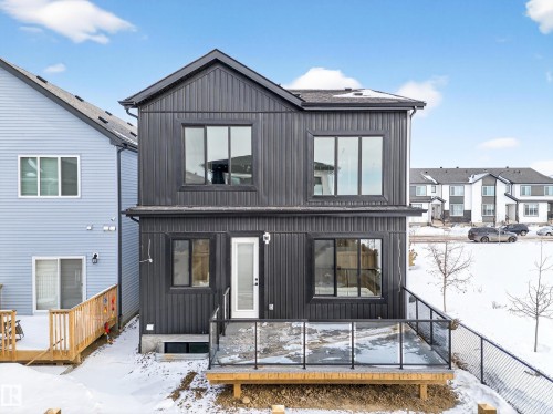 View of front of house featuring a wooden deck and a residential view - 132 29 Street, Edmonton, AB - Outdoor