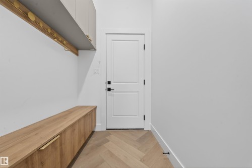Mudroom featuring parquet floors and baseboards - 132 29 Street, Edmonton, AB - Indoor Photo Showing Other Room