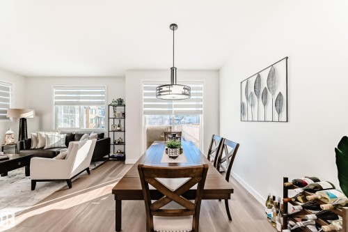Dining area with wood finished floors and baseboards - 3569 Erlanger Link, Edmonton, AB - Indoor