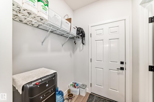 Walk in closet featuring wood finished floors - 3569 Erlanger Link, Edmonton, AB - Indoor With Storage