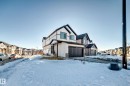 View of front of property featuring a residential view and a garage - 3569 Erlanger Link, Edmonton, AB  - Outdoor 