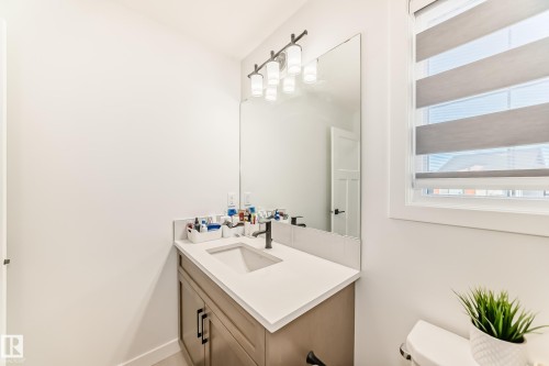Bathroom with toilet and vanity - 3569 Erlanger Link, Edmonton, AB - Indoor Photo Showing Bathroom