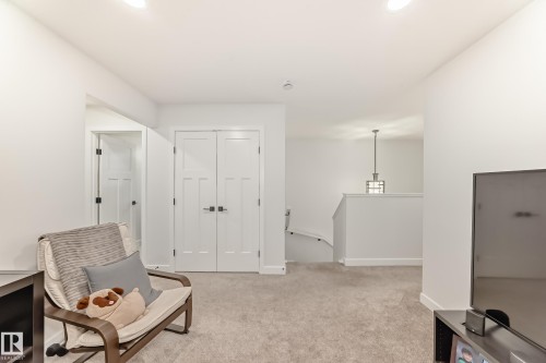 Sitting room with an upstairs landing, carpet floors, and recessed lighting - 3569 Erlanger Link, Edmonton, AB - Indoor Photo Showing Other Room