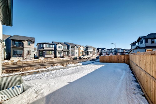 Yard covered in snow featuring a residential view - 3569 Erlanger Link, Edmonton, AB - Outdoor
