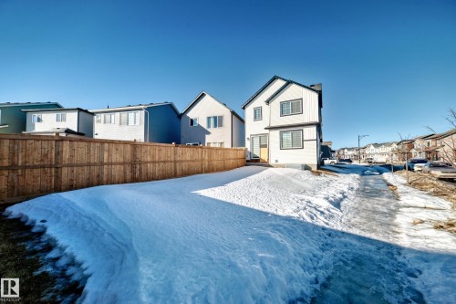Snow covered house featuring a residential view - 3569 Erlanger Link, Edmonton, AB - Outdoor