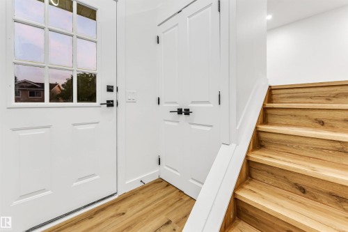 Doorway to outside with wood finished floors and stairs - 4616 32 Avenue, Edmonton, AB - Indoor Photo Showing Other Room