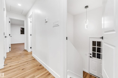 Hallway with light wood-style floors and baseboards - 4616 32 Avenue, Edmonton, AB - Indoor Photo Showing Other Room